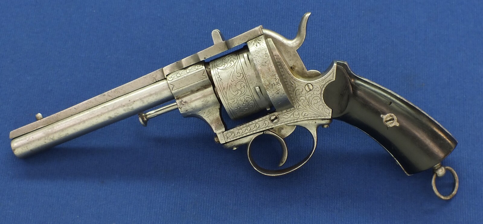 An antique unrestored French 12mm engraved Pinfire Revolver. 6 shot double action. Ebony grips. Length 29,5cm. In fair/good condition. 