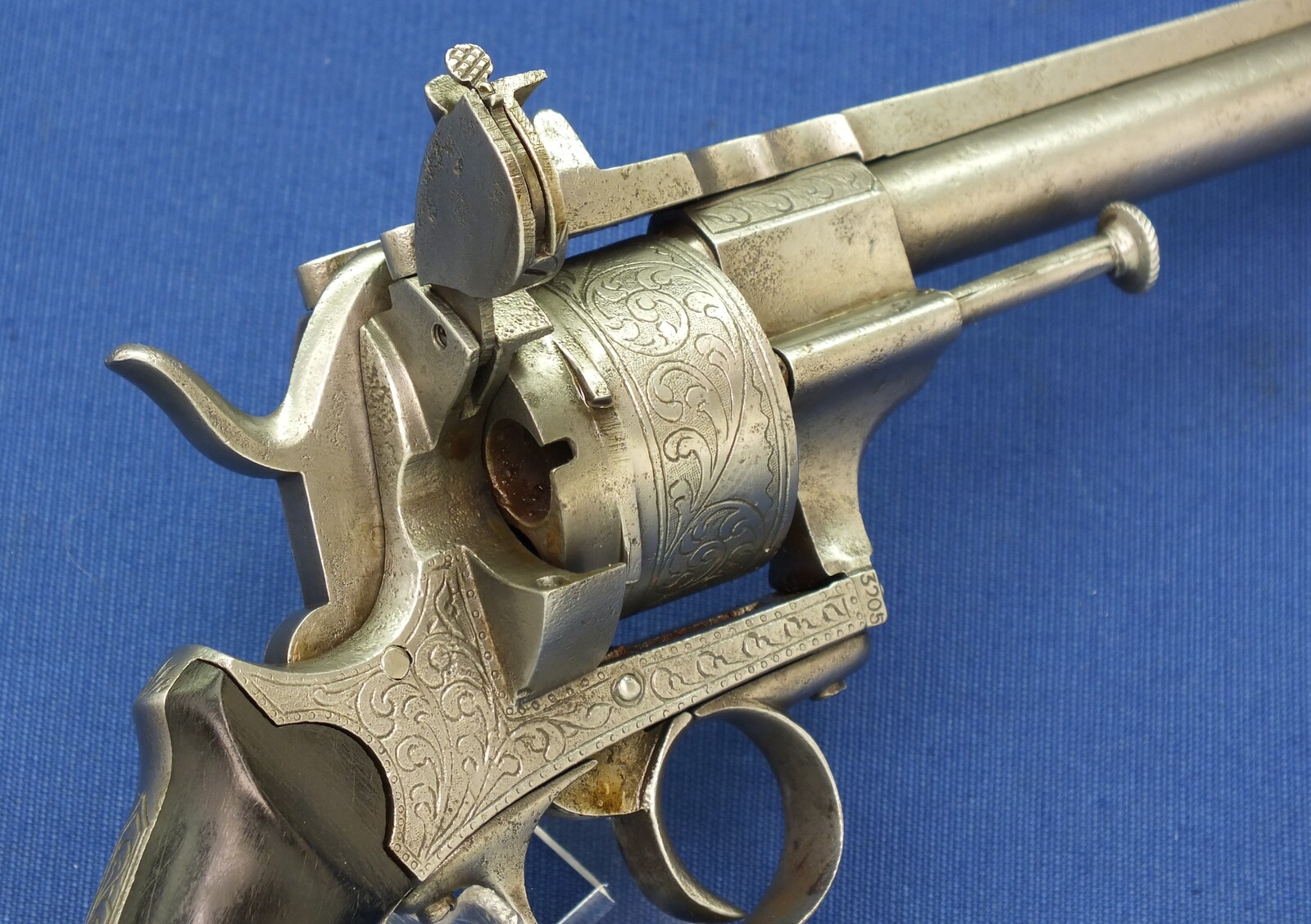 An antique unrestored French 12mm engraved Pinfire Revolver. 6 shot double action. Ebony grips. Length 29,5cm. In fair/good condition. 