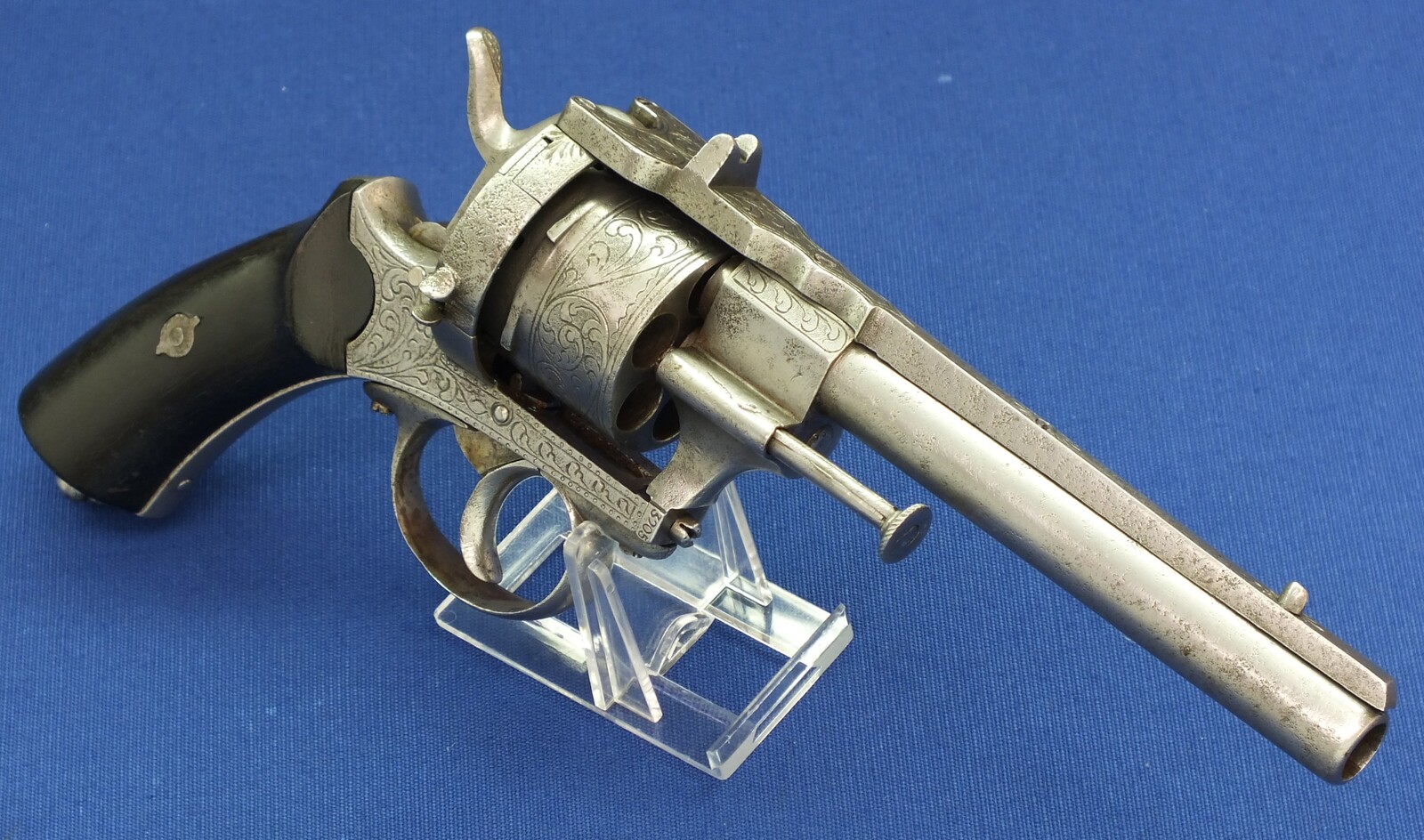 An antique unrestored French 12mm engraved Pinfire Revolver. 6 shot double action. Ebony grips. Length 29,5cm. In fair/good condition. 