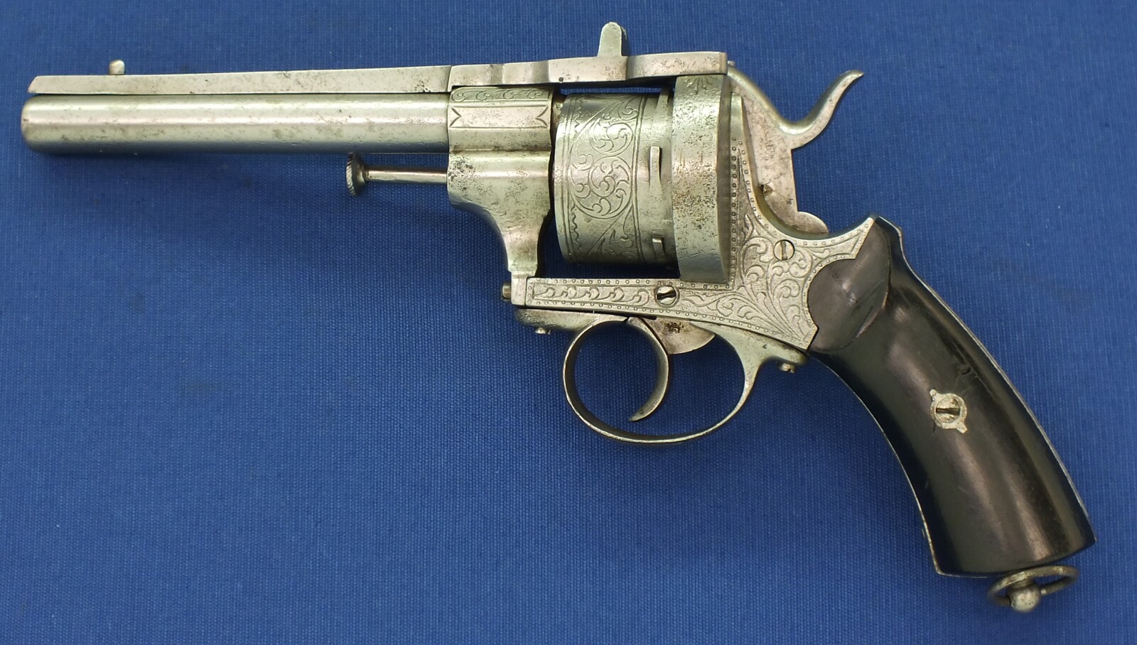 An antique unrestored French 12mm engraved Pinfire Revolver. 6 shot double action. Ebony grips. Length 29,5cm. In fair/good condition. 