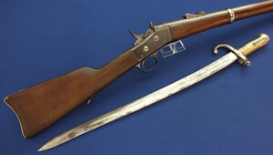 An antique US Remington Rolling Block Egyptian Model 1869 Rifle with Yatagan Bayonet. 35 inch barrel. Caliber 11.5mm. Length 128cm. In very good condition. Price 950 euro.